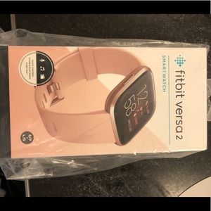 Brand new un opened Fitbit versa smart watch